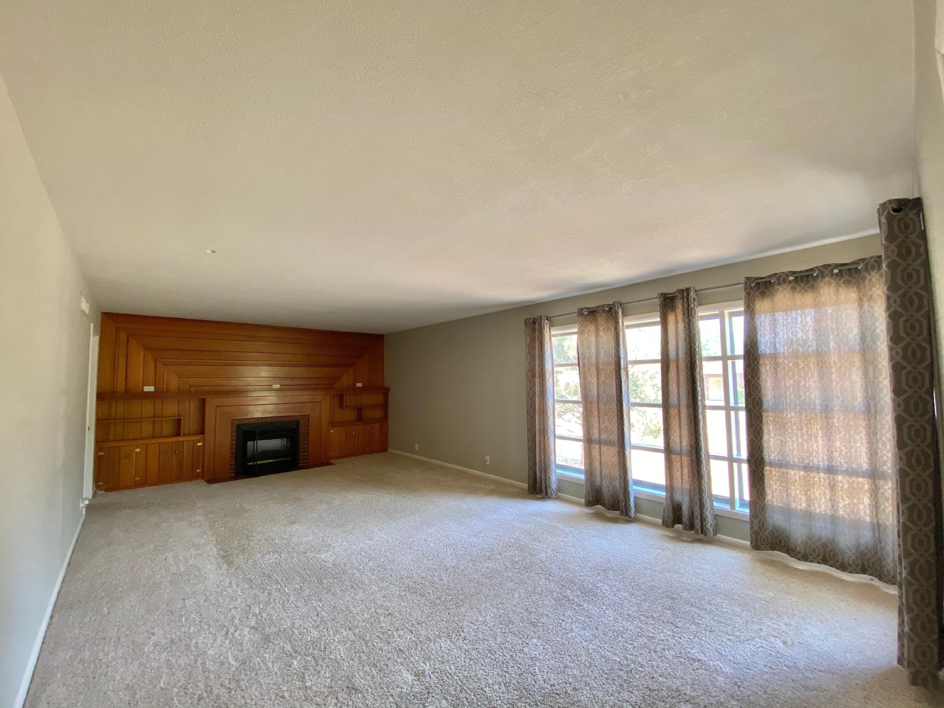 3509 37th Street Lubbock, TX 79413 - Photo 4 of 24 an empty room with furniture and a window