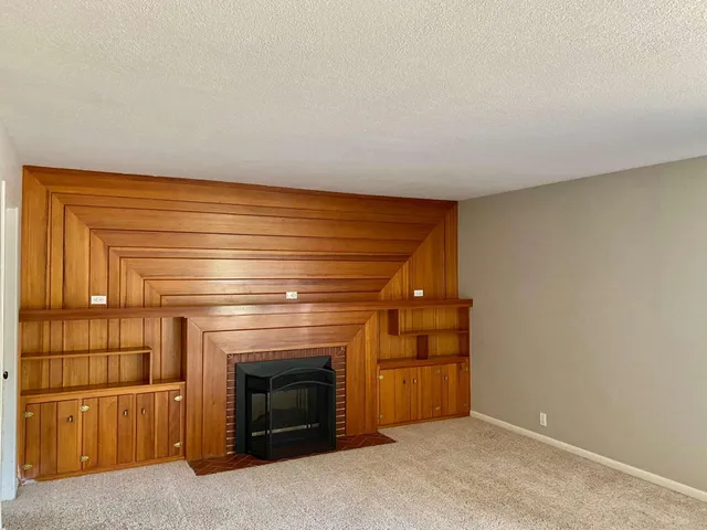 a living room with a fireplace