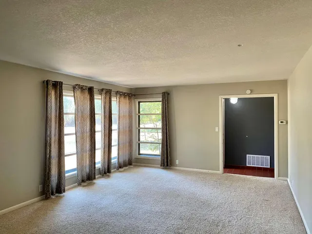 a large parking space in front of a building