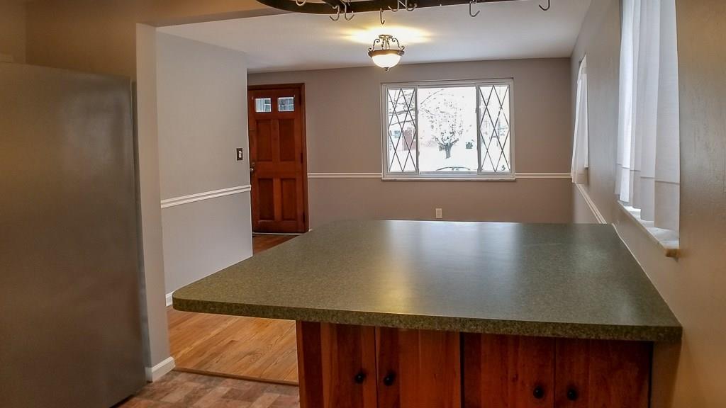 1097 Harding Street Bridgeville, PA 15017 - Photo 5 of 24 Large Kitchen Island Overlooking Dining Room