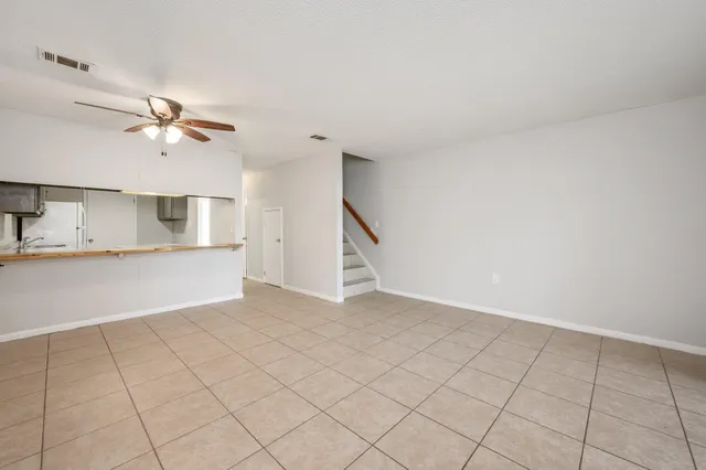 a view of a kitchen with microwave and a sink