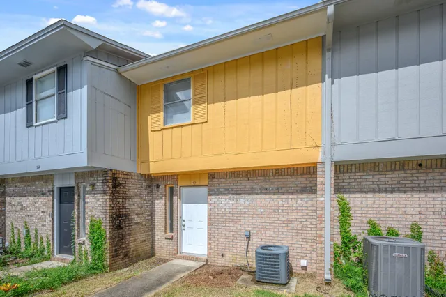 a front view of a house with parking