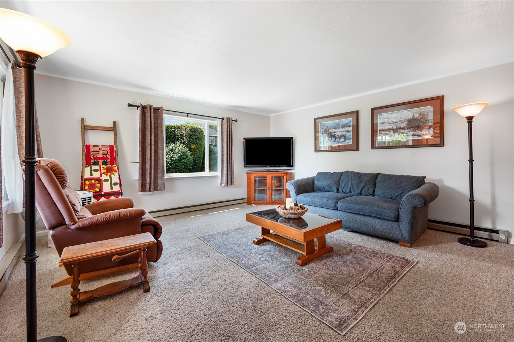 210 Mocliff Road Ephrata, WA 98823 - Photo 5 of 25 a living room with furniture a flat screen tv and a window