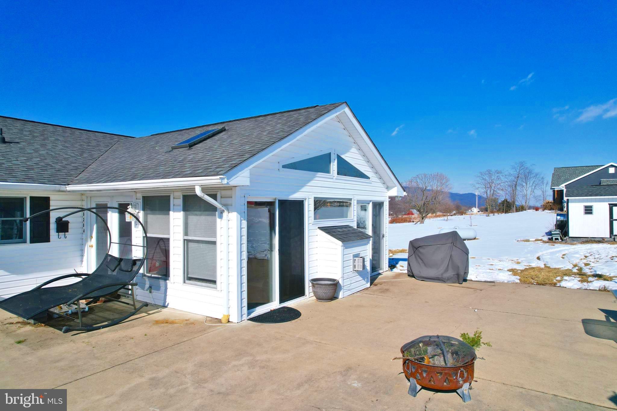 8284 Back Road Maurertown, VA 22644 - Photo 17 of 54 a front view of a house with parking