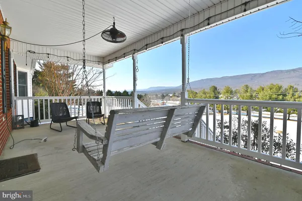 a view of a chairs and table in the patio