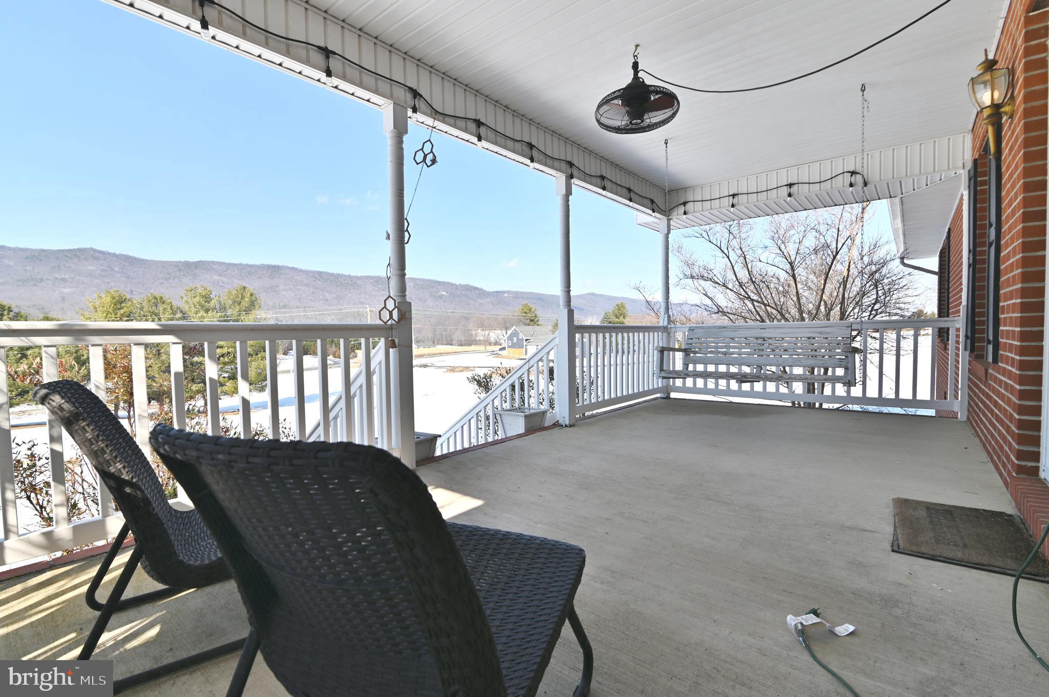 8284 Back Road Maurertown, VA 22644 - Photo 21 of 54 a view of a porch with furniture