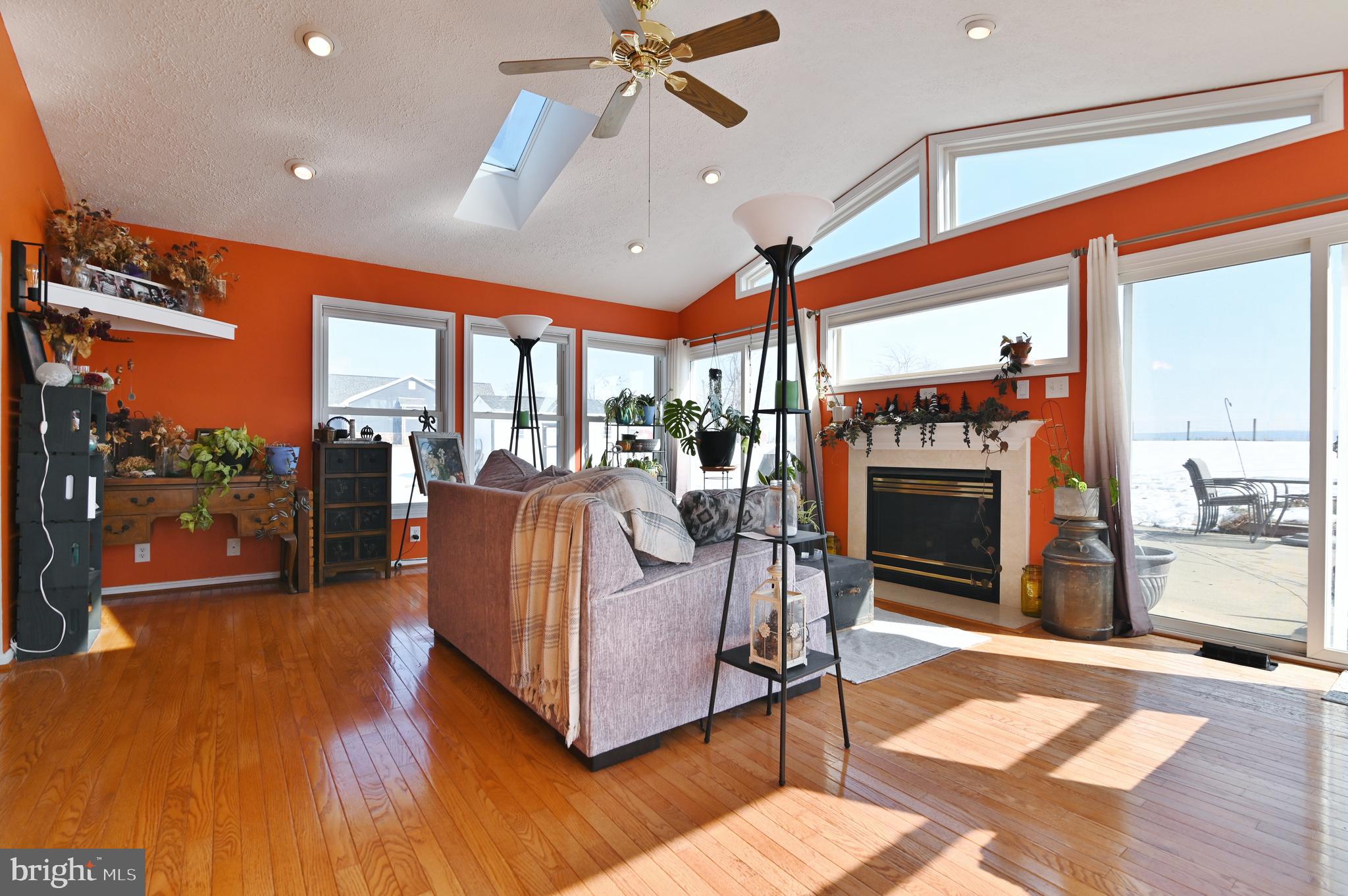 8284 Back Road Maurertown, VA 22644 - Photo 23 of 54 a living room with fireplace furniture and a floor to ceiling window