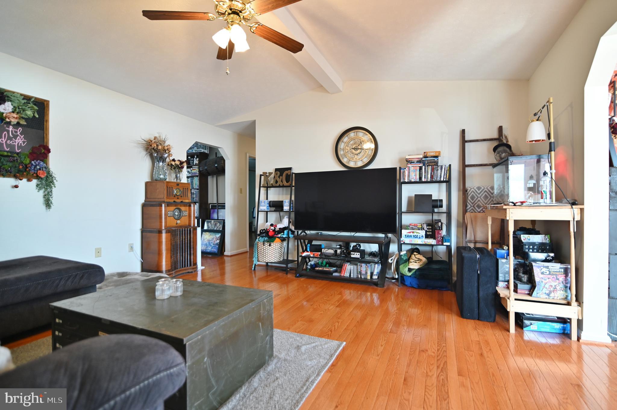 8284 Back Road Maurertown, VA 22644 - Photo 30 of 54 a living room with furniture and a flat screen tv