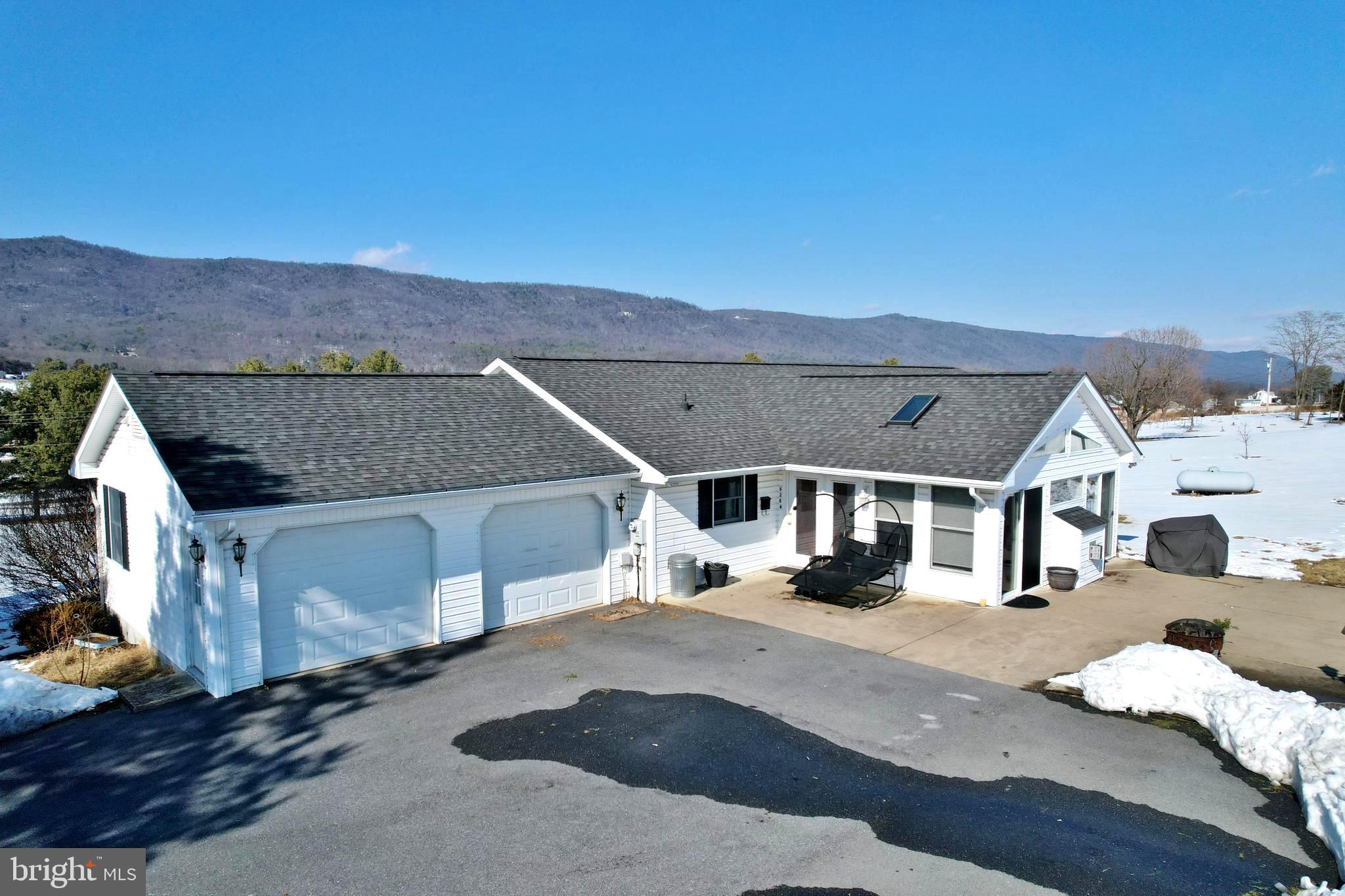 8284 Back Road Maurertown, VA 22644 - Photo 3 of 54 a view of a house with a patio