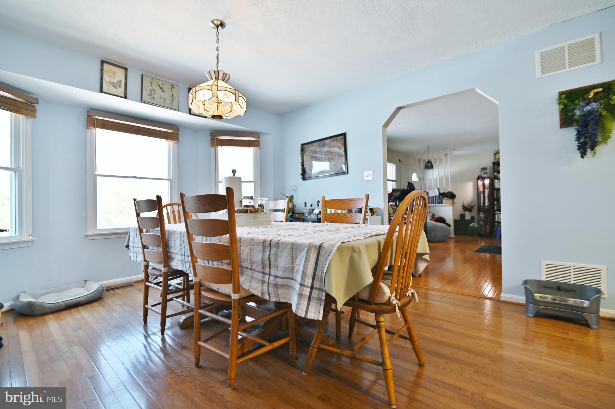 8284 Back Road Maurertown, VA 22644 - Photo 31 of 54 a view of a dining room with furniture window and wooden floor