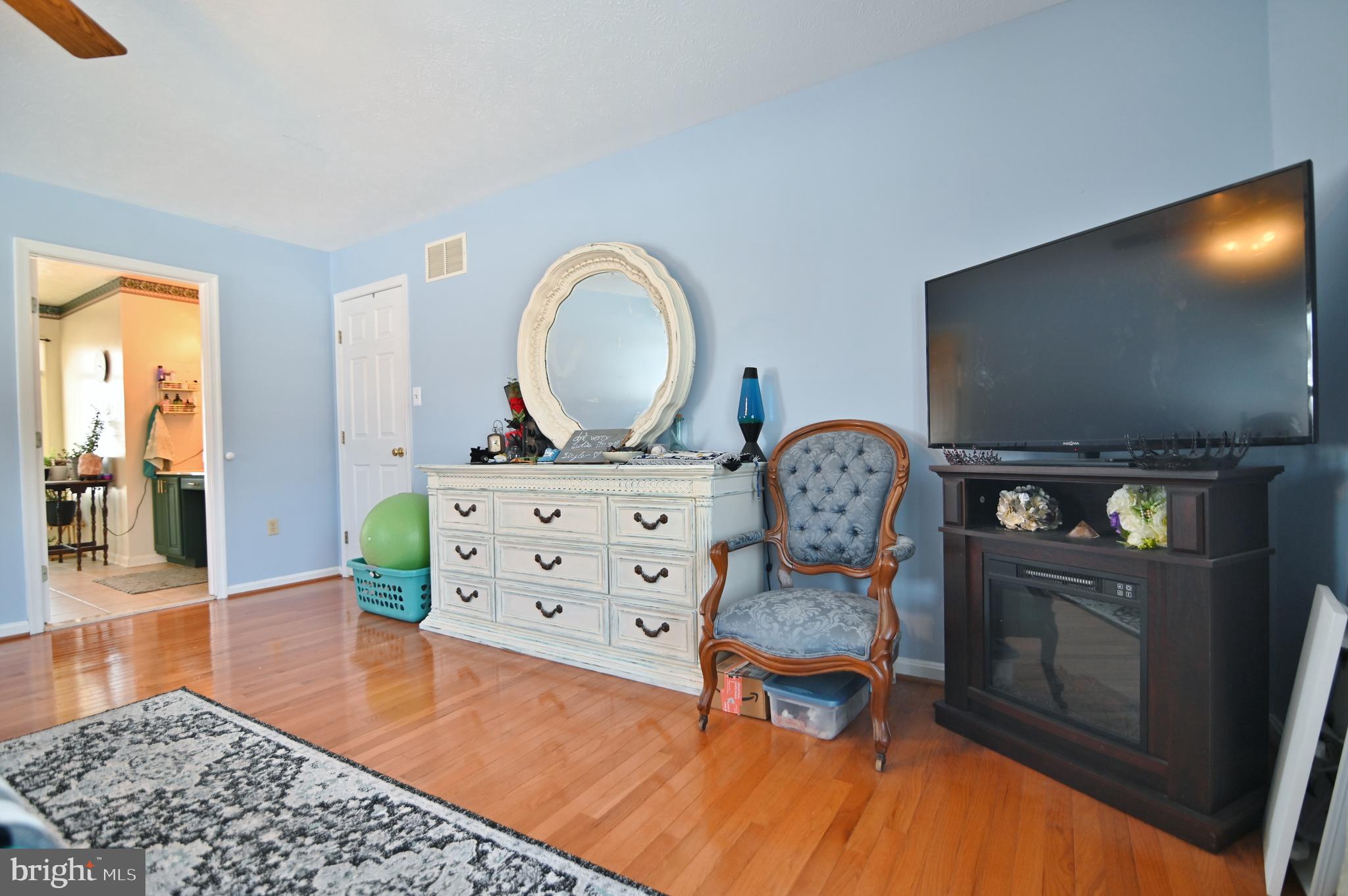 8284 Back Road Maurertown, VA 22644 - Photo 35 of 54 a living room with furniture and a flat screen tv