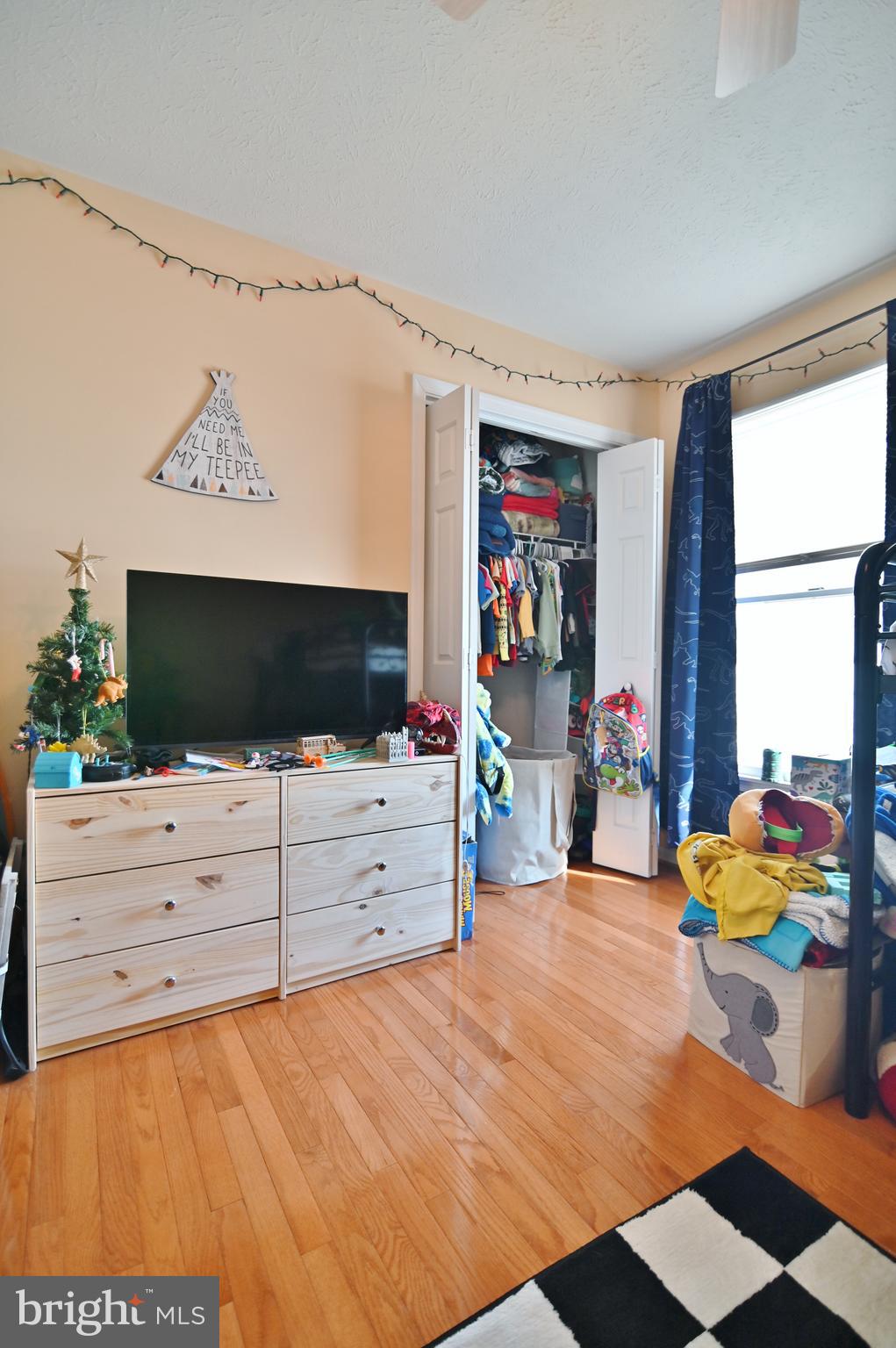 8284 Back Road Maurertown, VA 22644 - Photo 40 of 54 a bedroom with a bed and a flat screen tv