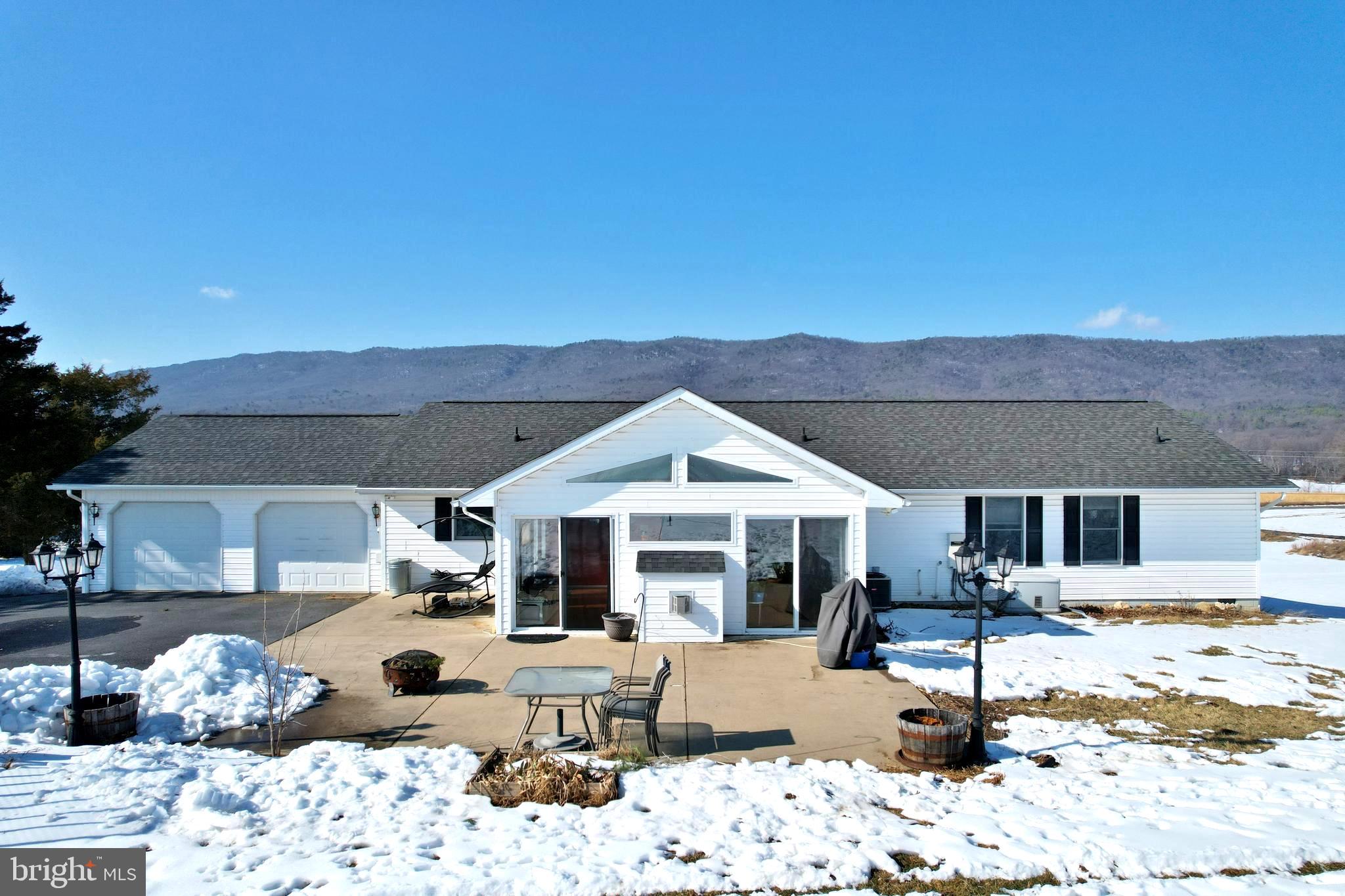 8284 Back Road Maurertown, VA 22644 - Photo 4 of 54 a front view of a house with a yard