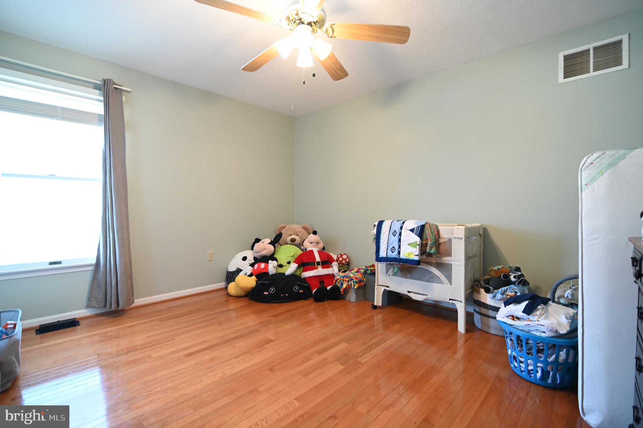 8284 Back Road Maurertown, VA 22644 - Photo 41 of 54 a bedroom with furniture and a wooden floor