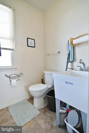 a bathroom with a sink a toilet and vanity
