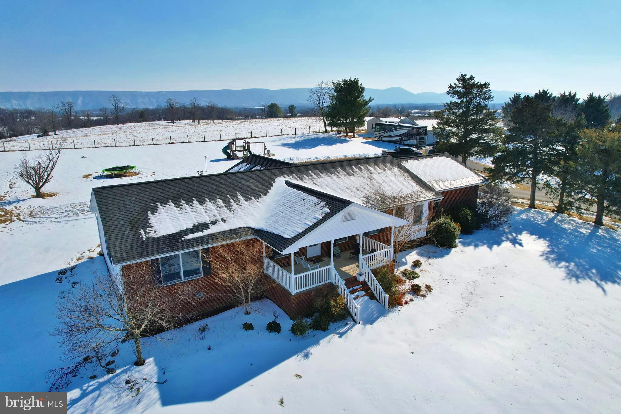 8284 Back Road Maurertown, VA 22644 - Photo 6 of 54 an aerial view of a house with a yard