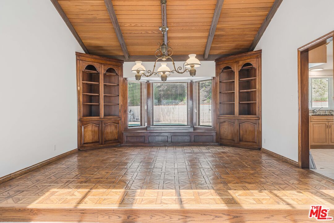 1181 Somera Road Los Angeles, CA 90077 - Photo 7 of 40 a view of a room with wooden floor and windows