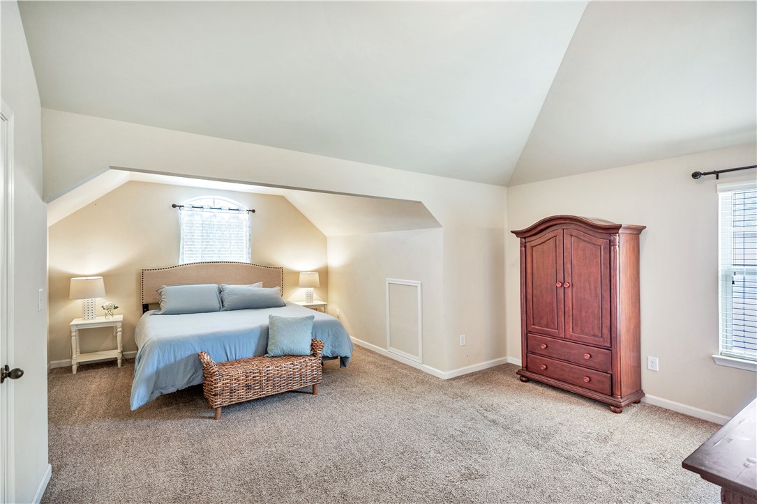 144 Buckland Drive Anderson, SC 29621 - Photo 17 of 48 Sloped ceilings and a warm carpeted floor invite comfort in this airy bedroom.