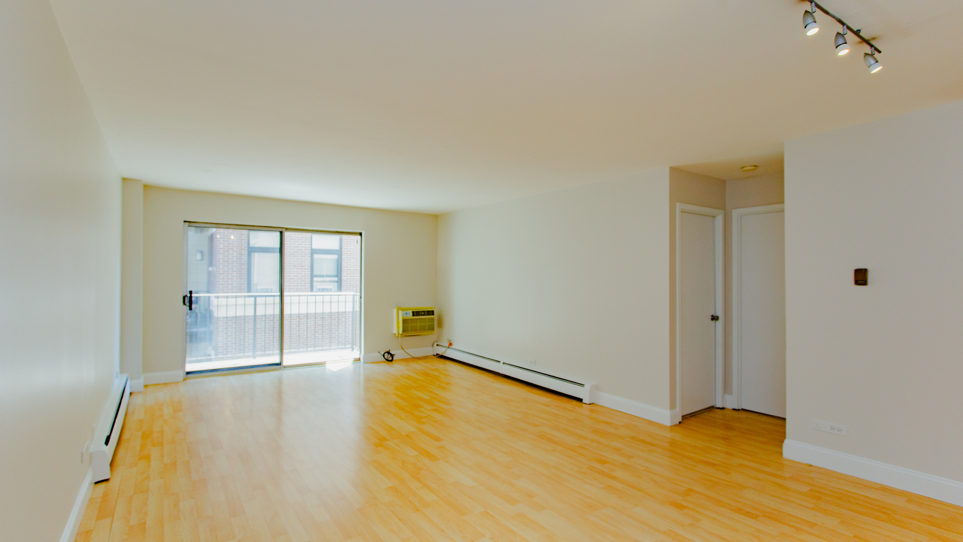 1567 Ridge Avenue, Unit 403 Evanston, IL 60201 - Photo 7 of 20 a view of an empty room with wooden floor