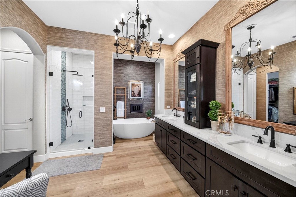 16375 Ory Circle Riverside, CA 92503 - Photo 26 of 51 a spacious bathroom with a granite countertop sink a toilet a mirror and shower