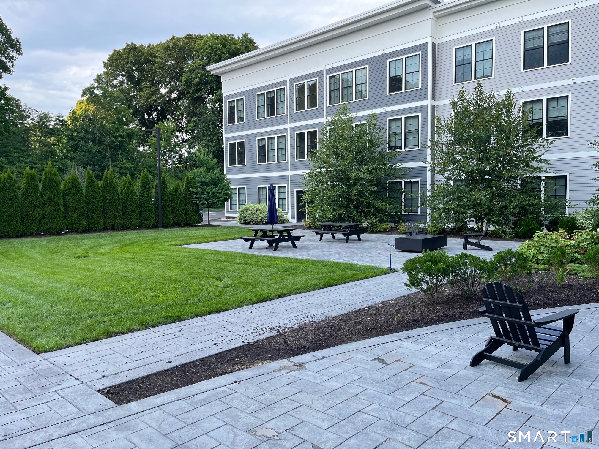 33 Old Tavern Road Orange, CT 06477 - Photo 9 of 28 Common courtyard in rear with propane fire pits