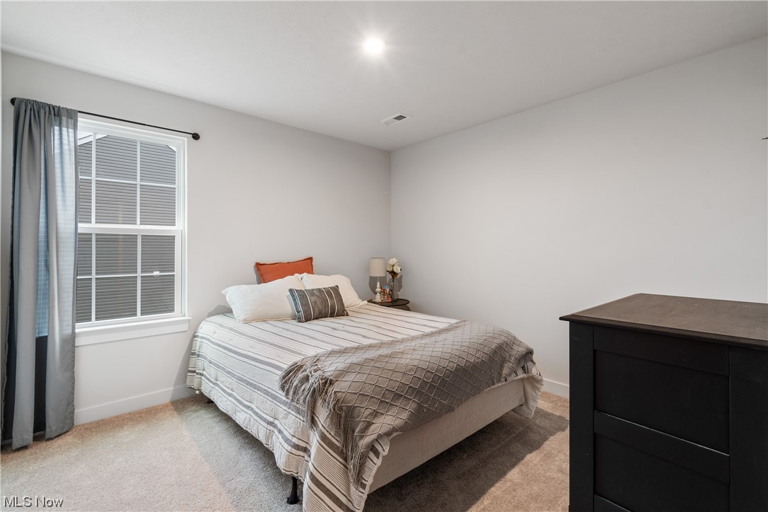 524 Oliver Way Rittman, OH 44270 - Photo 22 of 33 Bedroom featuring light colored carpet