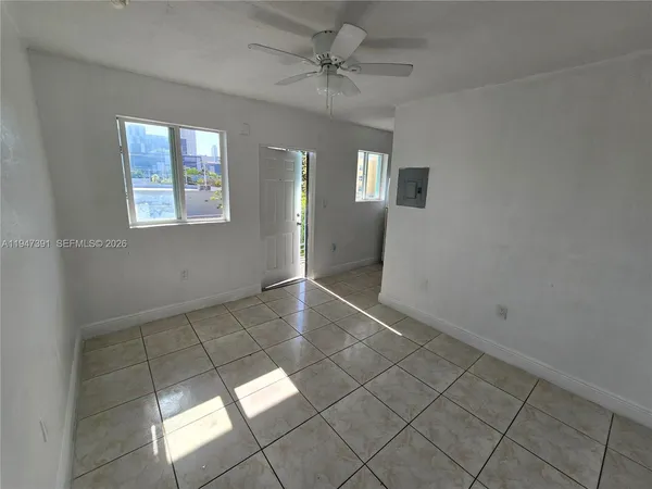 a view of an empty room and window