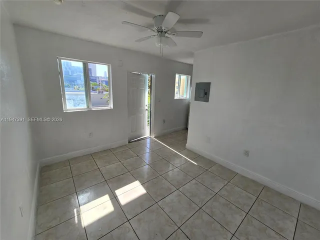 a view of an empty room and window