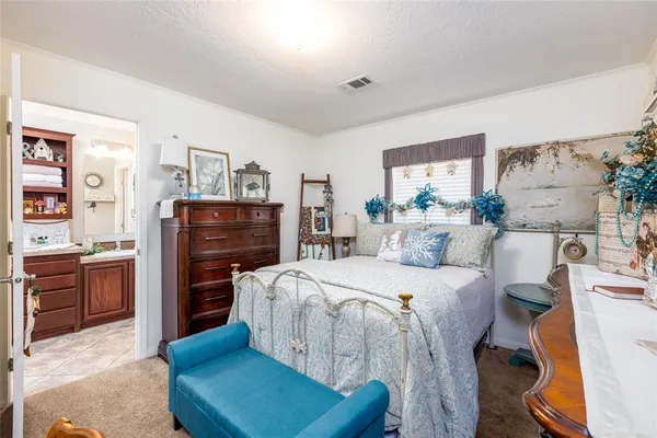 a bedroom with a bed and furniture