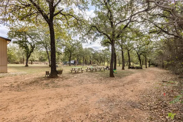 a backyard of a house with yard and outdoor seating
