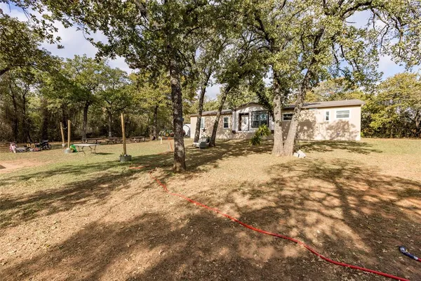 a house with trees in front of it