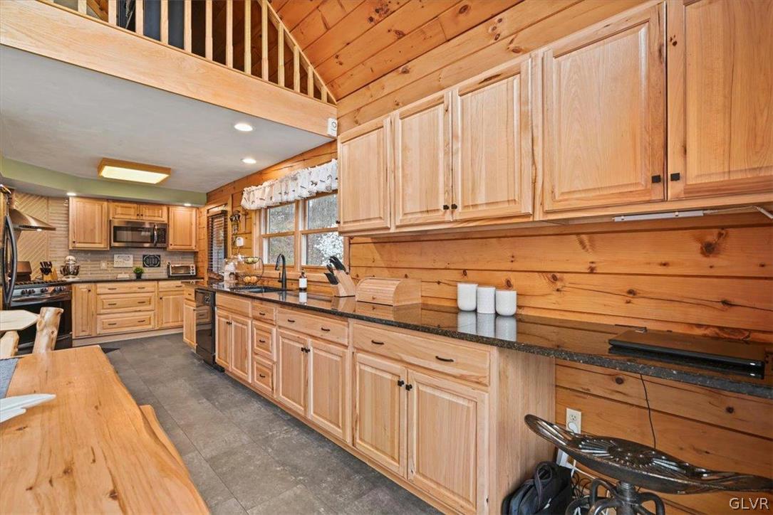 461 T Rte 318 Moscow, PA 18444 - Photo 16 of 50 a kitchen with granite countertop a sink and cabinets