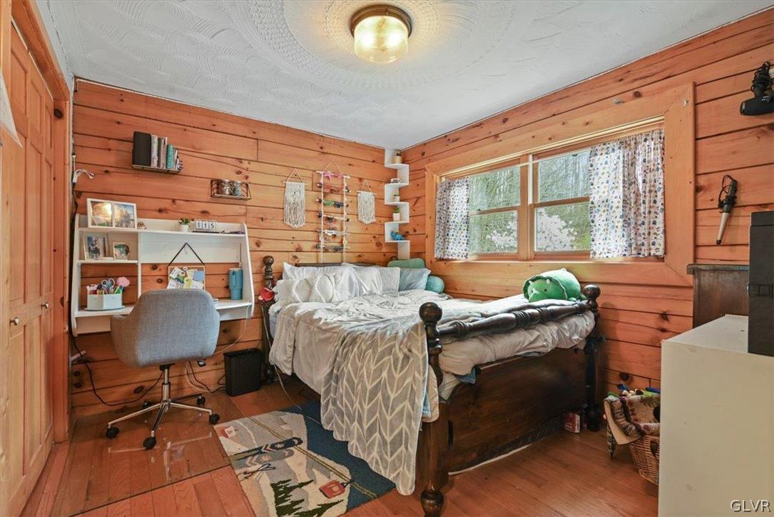 461 T Rte 318 Moscow, PA 18444 - Photo 20 of 50 a bed room with a bed and a chair