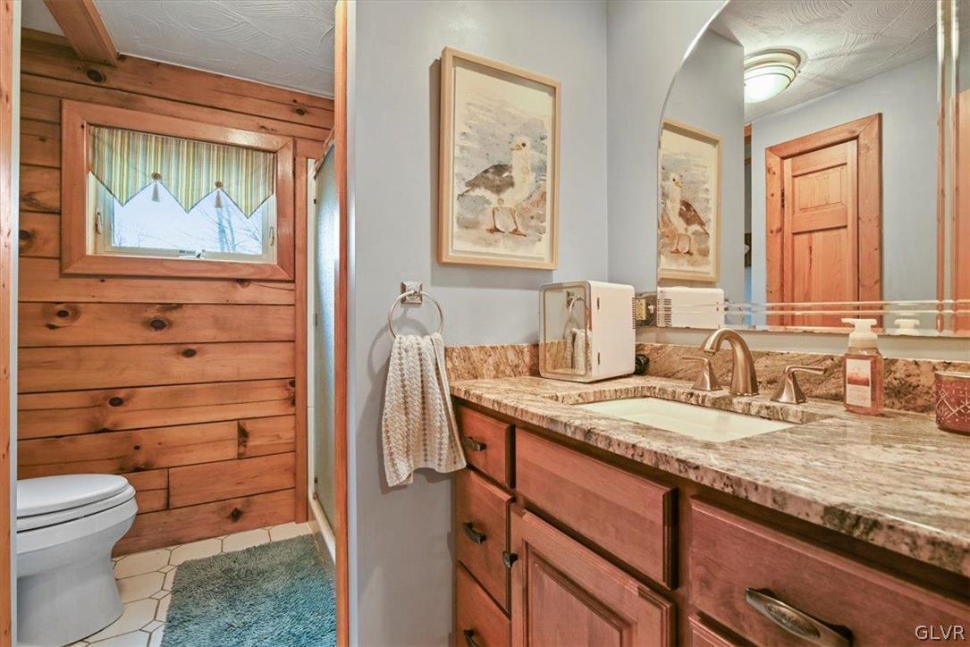 461 T Rte 318 Moscow, PA 18444 - Photo 21 of 50 a bathroom with a granite countertop toilet sink and mirror