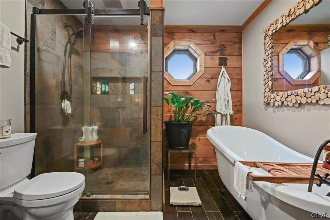 461 T Rte 318 Moscow, PA 18444 - Photo 27 of 50 a bathroom with a toilet a sink and a mirror