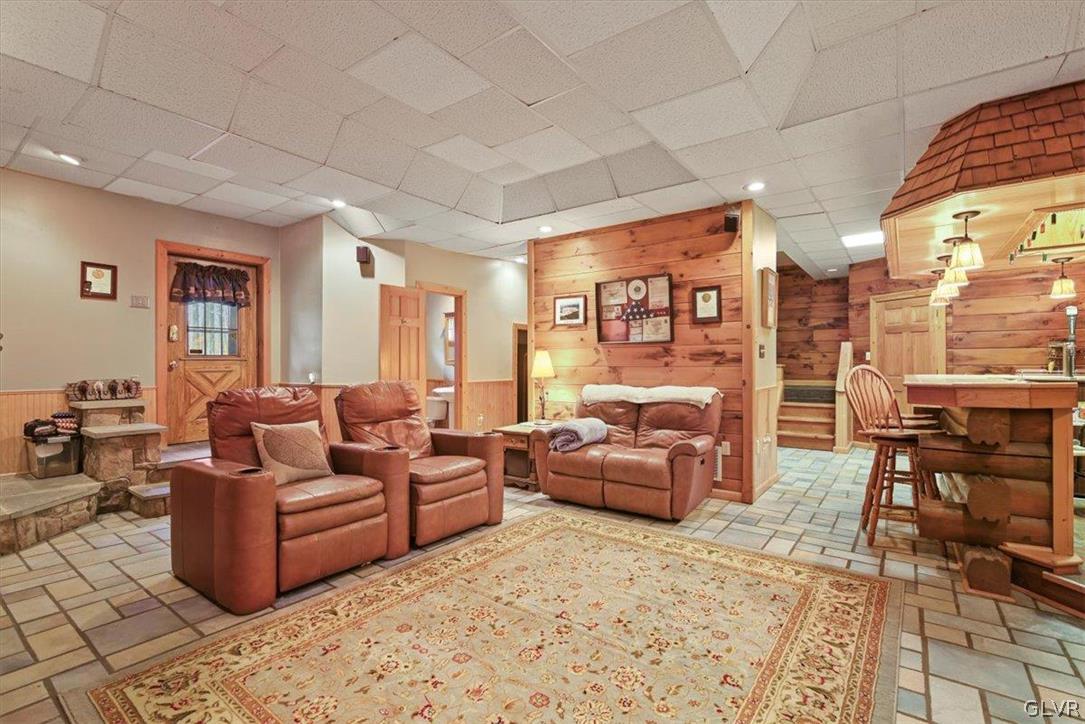 461 T Rte 318 Moscow, PA 18444 - Photo 32 of 50 a living room with fireplace furniture and a rug