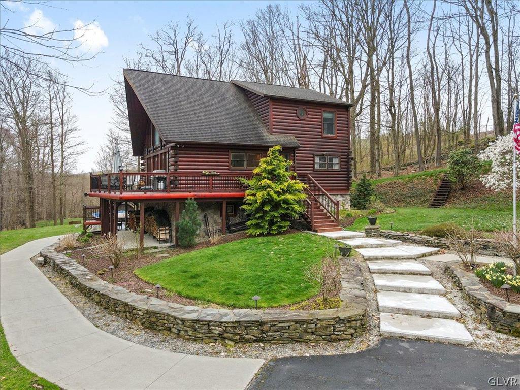 461 T Rte 318 Moscow, PA 18444 - Photo 35 of 50 a view of a house with backyard sitting area and garden