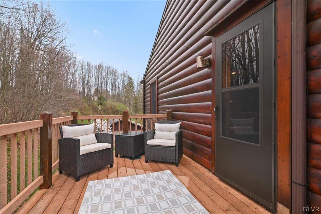 461 T Rte 318 Moscow, PA 18444 - Photo 40 of 50 a balcony with wooden floor and furniture