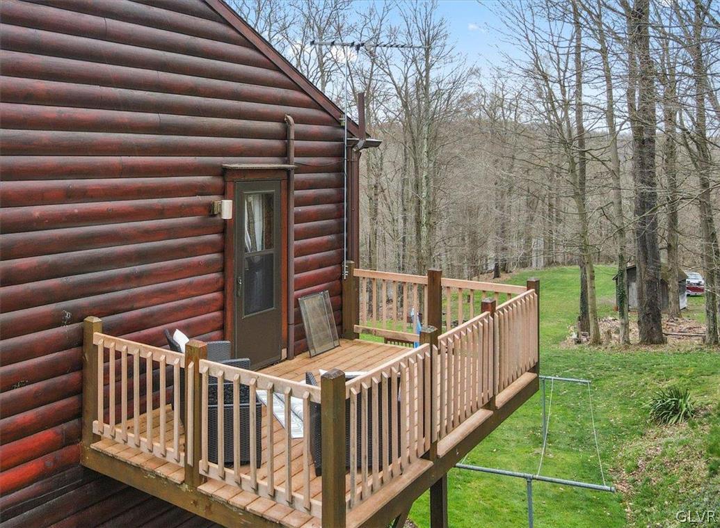 461 T Rte 318 Moscow, PA 18444 - Photo 42 of 50 a view of backyard with deck and trees