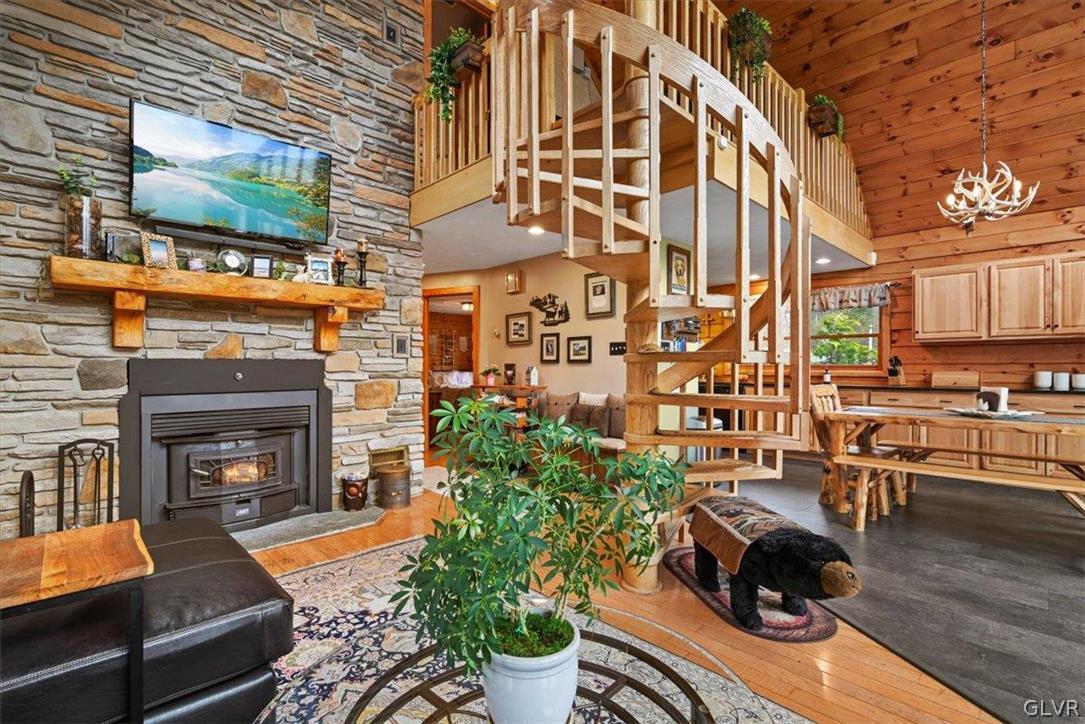 461 T Rte 318 Moscow, PA 18444 - Photo 5 of 50 a living room with furniture a flat screen tv and a fireplace