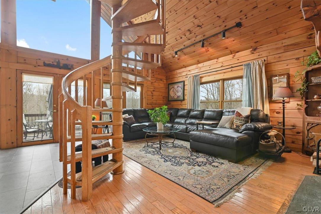 461 T Rte 318 Moscow, PA 18444 - Photo 7 of 50 a living room with furniture a rug and a chandelier
