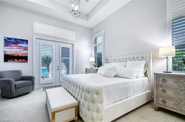 a view of a dining room with furniture wooden floor and chandelier