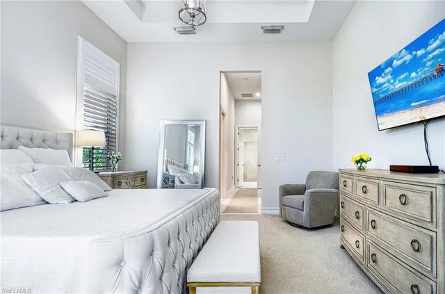 a bedroom with a bed and a couch