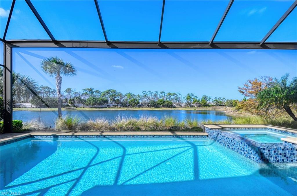 6159 Rodney Bay Lane Naples, FL 34113 - Photo 29 of 50 a view of a lake from a balcony