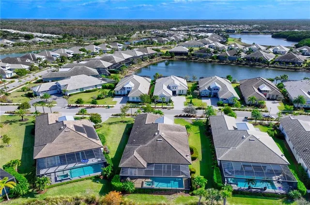an aerial view of a house with a swimming pool yard and outdoor seating