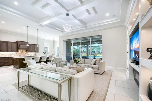 a kitchen with stainless steel appliances kitchen island granite countertop a sink and cabinets