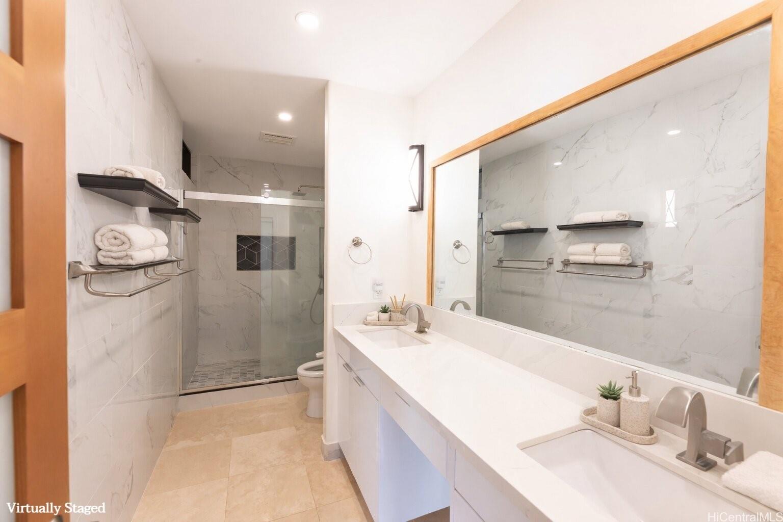 1632 Ihiloa Loop Honolulu, HI 96821 - Photo 15 of 24 a bathroom with a double vanity sink mirror and shower