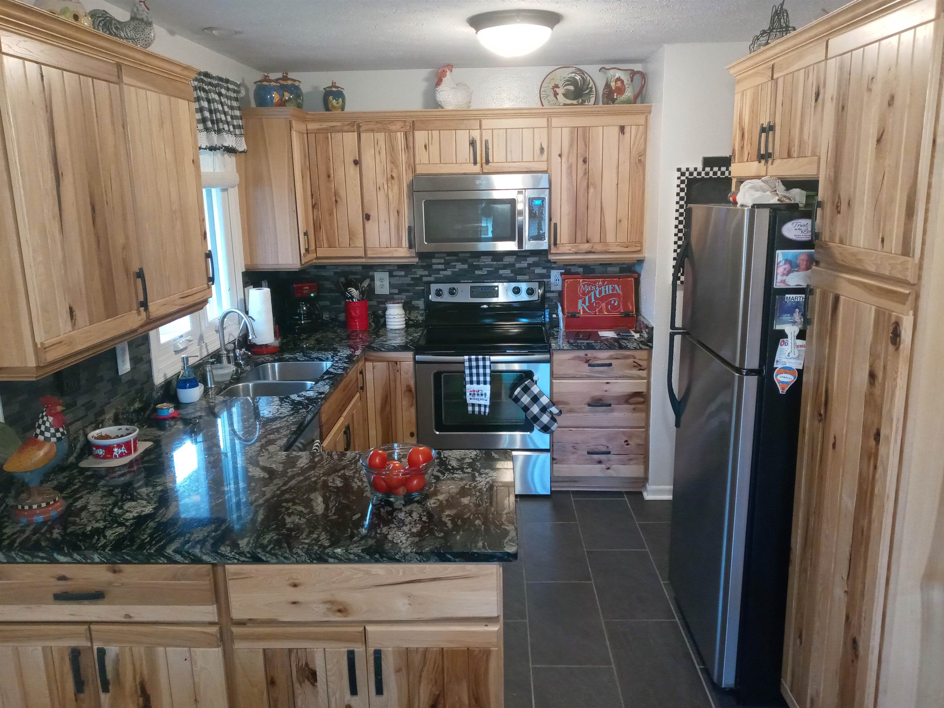 207 Westfield Road Winnebago, IL 61088 - Photo 13 of 27 a kitchen with stainless steel appliances a refrigerator and a stove