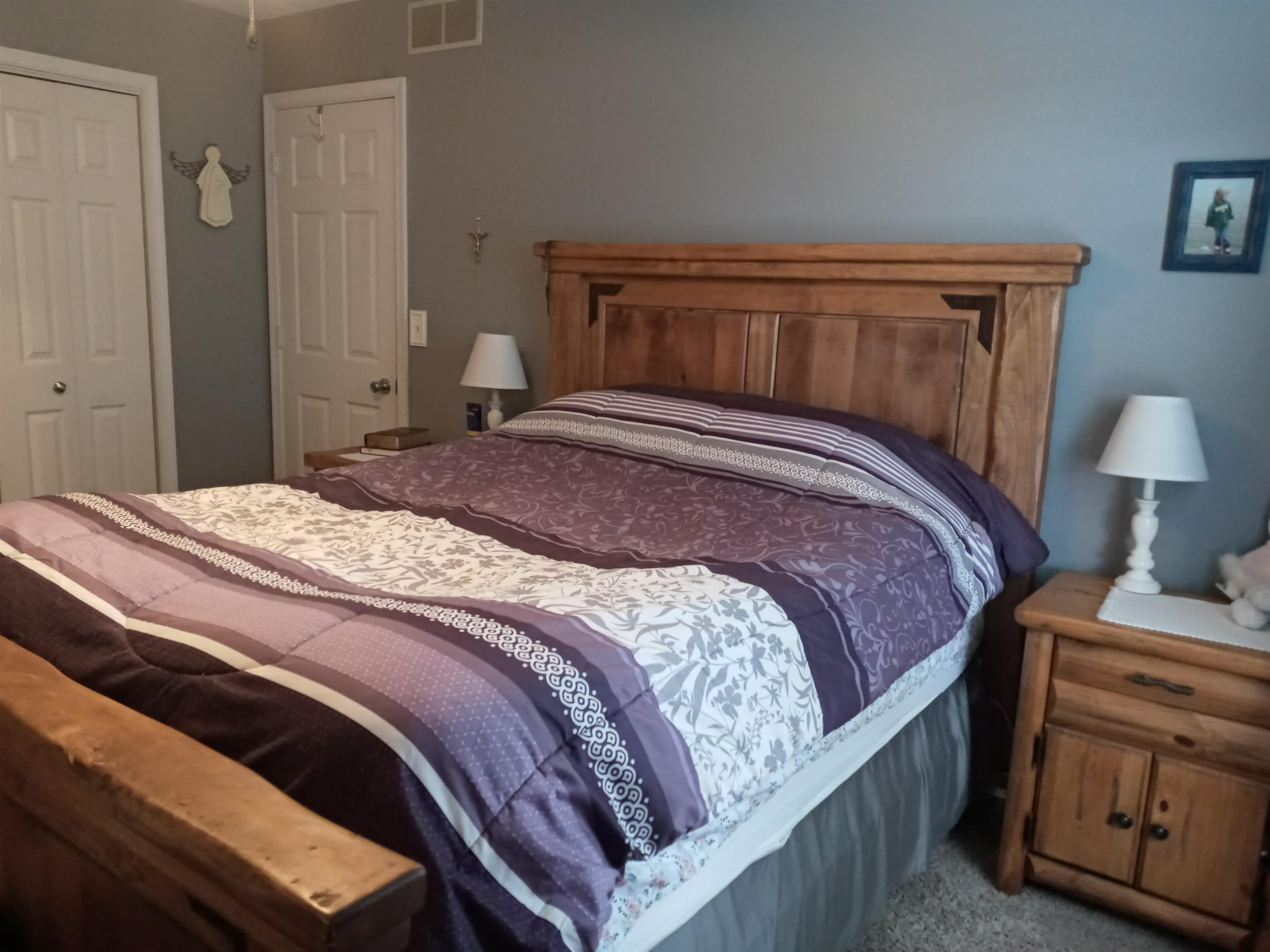 207 Westfield Road Winnebago, IL 61088 - Photo 21 of 27 a bedroom with a bed and a night stand