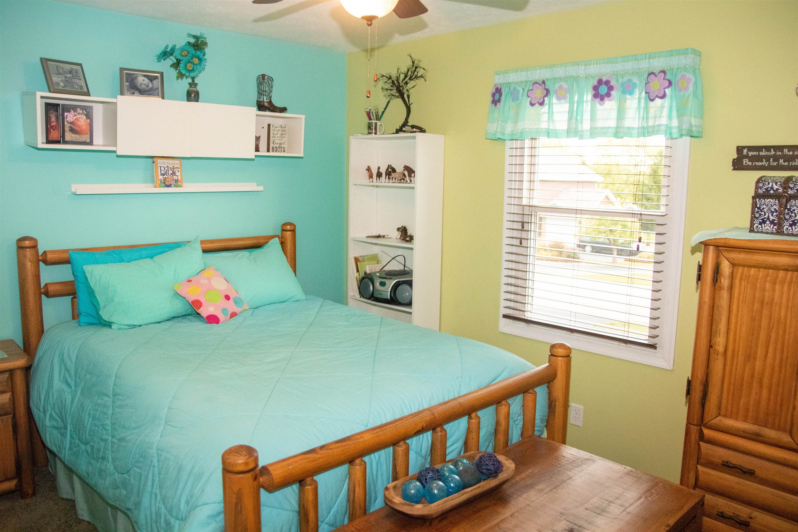 207 Westfield Road Winnebago, IL 61088 - Photo 22 of 27 a bedroom with furniture and a window